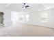 Spacious main bedroom features tray ceilings, ceiling fan and lots of natural light at 1236 Saxony Se Dr, Conyers, GA 30013