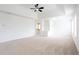 Spacious primary bedroom featuring tray ceilings and plush carpeting at 1236 Saxony Se Dr, Conyers, GA 30013