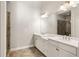 Bathroom featuring double vanity with white cabinets and large mirror at 3032 Hartford Mill Pl, Duluth, GA 30097