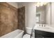 Bathroom with tub, shower, and vanity with black cabinets at 3032 Hartford Mill Pl, Duluth, GA 30097
