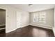 Bedroom with hardwood floors, large window, and natural light at 3032 Hartford Mill Pl, Duluth, GA 30097
