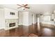 Spacious living room featuring a fireplace, hardwood floors, and an open floor plan at 3032 Hartford Mill Pl, Duluth, GA 30097