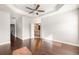 Bright main bedroom with tray ceiling, ceiling fan, and ensuite bathroom access at 3032 Hartford Mill Pl, Duluth, GA 30097