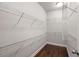 Walk-in closet with wire shelving and hardwood flooring at 3032 Hartford Mill Pl, Duluth, GA 30097