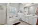 Bathroom featuring a tub and double sinks at 3080 Autumn Woods Ct, Douglasville, GA 30135