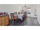 The dining area has hardwood floors, a view of the backyard and space for 8 chairs at 3080 Autumn Woods Ct, Douglasville, GA 30135