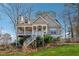 Charming two-story home with a welcoming front porch and manicured landscaping at 3080 Autumn Woods Ct, Douglasville, GA 30135