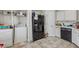 Kitchen area including a refrigerator, dishwasher, and laundry area at 3080 Autumn Woods Ct, Douglasville, GA 30135