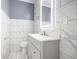 Contemporary bathroom featuring modern fixtures, a sleek vanity, and marble-look tiles, creating a spa-like atmosphere at 441 Pomona Sw Cir, Atlanta, GA 30315