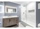 Bathroom features marble tile, glass shower door and stylish vanity at 441 Pomona Sw Cir, Atlanta, GA 30315