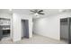 Bright bedroom featuring a ceiling fan, two closets, and an ensuite bathroom with modern finishes at 441 Pomona Sw Cir, Atlanta, GA 30315