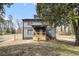 Charming gray two-story home featuring a cozy wooden porch, with a yard needing some TLC at 441 Pomona Sw Cir, Atlanta, GA 30315