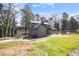 Two-story home features a newly poured concrete driveway and large grassy areas at 441 Pomona Sw Cir, Atlanta, GA 30315