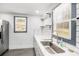 Bright kitchen features subway tile, open shelving and stainless-steel appliances at 441 Pomona Sw Cir, Atlanta, GA 30315