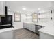 Beautiful kitchen with stainless appliances, subway tile, grey cabinets, and open shelving at 441 Pomona Sw Cir, Atlanta, GA 30315