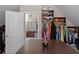 This spacious walk-in closet features lots of shelving, drawers, and clothes rods and connects to the bathroom at 1615 Chattahoochee Run, Suwanee, GA 30024