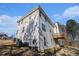 Exterior view showing the side and rear of the house with a wooden deck at 4230 Spur Look Xing, Douglasville, GA 30135