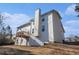 Exterior view showing the back of the house with a wooden deck, siding, and large windows at 4230 Spur Look Xing, Douglasville, GA 30135
