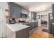 Modern kitchen with stainless steel appliances, gray cabinets, and large countertop at 4230 Spur Look Xing, Douglasville, GA 30135