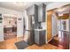 Modern kitchen with stainless steel appliances and gray cabinets, with views of a dining room at 4230 Spur Look Xing, Douglasville, GA 30135