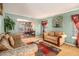 Open living room with couches and view into the dining room at 4230 Spur Look Xing, Douglasville, GA 30135