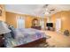 Spacious main bedroom with carpet flooring and ceiling fan and a window at 4230 Spur Look Xing, Douglasville, GA 30135