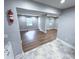 Bright living room with light gray paint, wood-look floors, and ample natural light at 1152 Greenwich Sw St, Atlanta, GA 30310