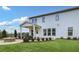Spacious backyard features a covered patio, stone fire pit, and manicured landscaping at 5410 Julep Ct, Cumming, GA 30028