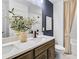 Modern bathroom featuring double sinks, elegant faucet, and neutral color palette at 5410 Julep Ct, Cumming, GA 30028