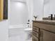 Bathroom featuring a vanity with granite countertops, a bathtub, and a shower with decorative tile at 5410 Julep Ct, Cumming, GA 30028