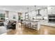 Bright kitchen with island seating, stainless steel appliances, and hardwood flooring at 5410 Julep Ct, Cumming, GA 30028