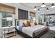 Bright main bedroom with a king bed, stylish lighting, and window views at 5410 Julep Ct, Cumming, GA 30028