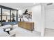 Stylish sitting area featuring modern furniture, neutral decor, and an accent wall with mirrors at 5410 Julep Ct, Cumming, GA 30028