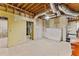 Unfinished basement with exposed rafters, concrete floor, and in-progress drywall at 8078 Longleaf Dr, Villa Rica, GA 30180
