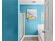Bright bathroom featuring blue walls, shower with glass door, and soaking tub at 8078 Longleaf Dr, Villa Rica, GA 30180