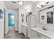 Bathroom boasts dual sinks, tiled flooring, and a walk-in closet at 8078 Longleaf Dr, Villa Rica, GA 30180