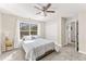 Bright bedroom featuring a ceiling fan, closet and window allowing natural light at 8078 Longleaf Dr, Villa Rica, GA 30180