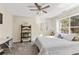 Bedroom featuring a ceiling fan, closet, and window overlooking the exterior at 8078 Longleaf Dr, Villa Rica, GA 30180