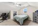 Bedroom featuring light colored carpet, a fan and natural light at 8078 Longleaf Dr, Villa Rica, GA 30180