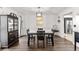 Dining room showcasing modern black furniture and stylish decor and hardwood flooring at 8078 Longleaf Dr, Villa Rica, GA 30180
