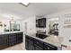 Modern kitchen with dark cabinetry, granite countertops and stainless steel appliances at 8078 Longleaf Dr, Villa Rica, GA 30180