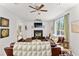 Inviting living room with a decorative fireplace, hardwood floors, and comfortable sofas at 8078 Longleaf Dr, Villa Rica, GA 30180