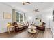 Comfortable living room with hardwood floors, two sofas, bright light, and neutral color scheme at 8078 Longleaf Dr, Villa Rica, GA 30180