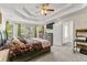 Spacious bedroom features a tray ceiling, many windows and neutral colors at 8078 Longleaf Dr, Villa Rica, GA 30180