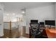 View of a home office space, featuring hardwood floors, white trim and a dark stained desk at 1514 Gilstrap Nw Ln, Atlanta, GA 30318