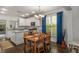 Bright eat-in kitchen with granite countertops, white cabinetry, and stainless steel appliances at 1514 Gilstrap Nw Ln, Atlanta, GA 30318