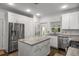 Gourmet kitchen with granite island, stainless steel appliances, and white cabinets at 1514 Gilstrap Nw Ln, Atlanta, GA 30318