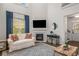 Inviting living room with a cozy fireplace, high ceilings, and staircase views at 1514 Gilstrap Nw Ln, Atlanta, GA 30318