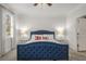 Relaxing primary bedroom featuring a tufted headboard, plush carpet, and side tables at 1514 Gilstrap Nw Ln, Atlanta, GA 30318