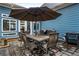 Outdoor patio with dining table, chairs, and umbrella for shaded seating at 1514 Gilstrap Nw Ln, Atlanta, GA 30318
